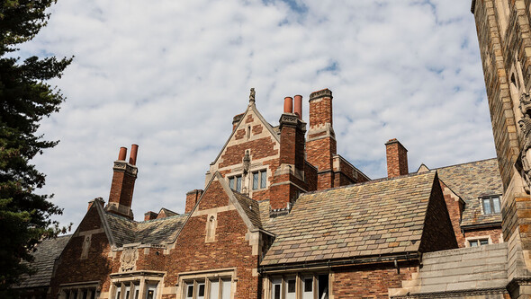 Interior courtyard elevation of Sterling Law Building with brick façade, pitched slate roofs, and brick chimneys