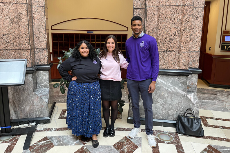3 people standing the CT state capitol