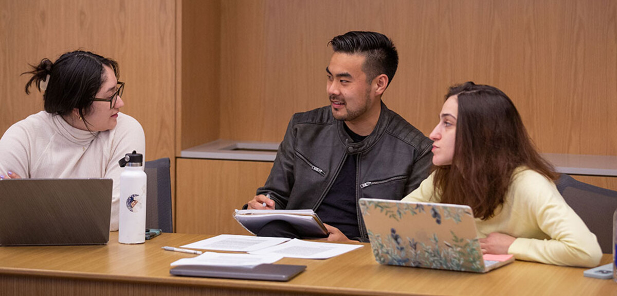 A small class meets in Baker Hall at the Law School.