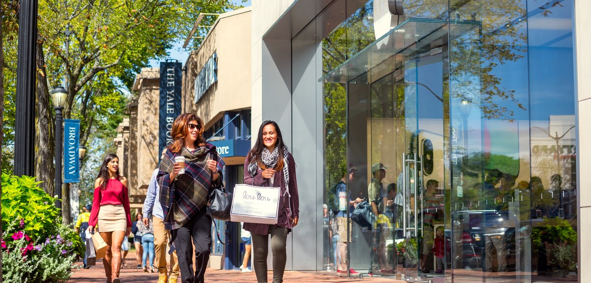 A street-view of happy shoppers in New Haven.