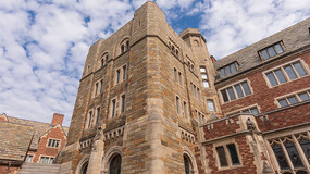 As seen from the courtyard of Sterling Law Building, the main stairwell's exterior stone walls exterior stone walls protrude from the brick façade