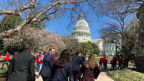 students walking toward the US Capitol